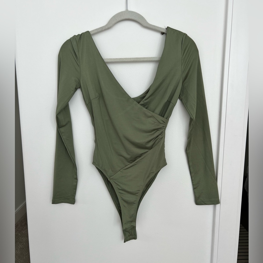 Green v neck body suit! NEVER WORN